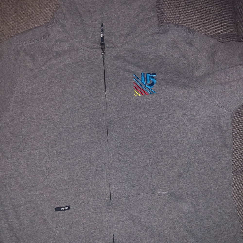 Silver Burton zip-up sweater. Medium